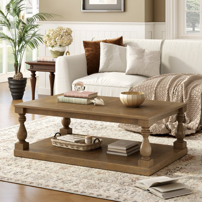 Table basse U_Style avec pieds en colonne et placage de pin luxueux pour un charme intemporel (table basse incluse, sans les chaises)
