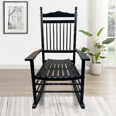 Fauteuil bascule de balcon/véranda noir - Fabriqué en bois massif, offrant une assise confortable et sécurisée, des accoudoirs et un dossier à lattes. Montage facile grâce à la quincaillerie et aux instructions incluses. Poids maximal supporté : 127 kg (280 lb).