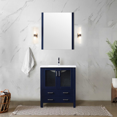 Meuble-lavabo bleu marine de 76 cm de large avec plateau en céramique blanche, miroir attrayant de 71 cm, tiroirs à fermeture douce et grand espace de rangement. Comptoir de salle de bain avec compartiments élégants et fermés.
