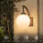 14" Black Outdoor Globe Wall Sconce With Frosted Glass