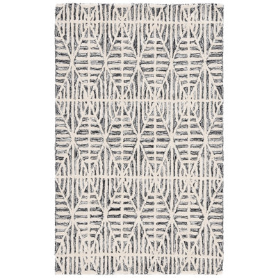 Tapis noir / ivoire en coton et viscose en laine et coton touffeté à la main Jimya