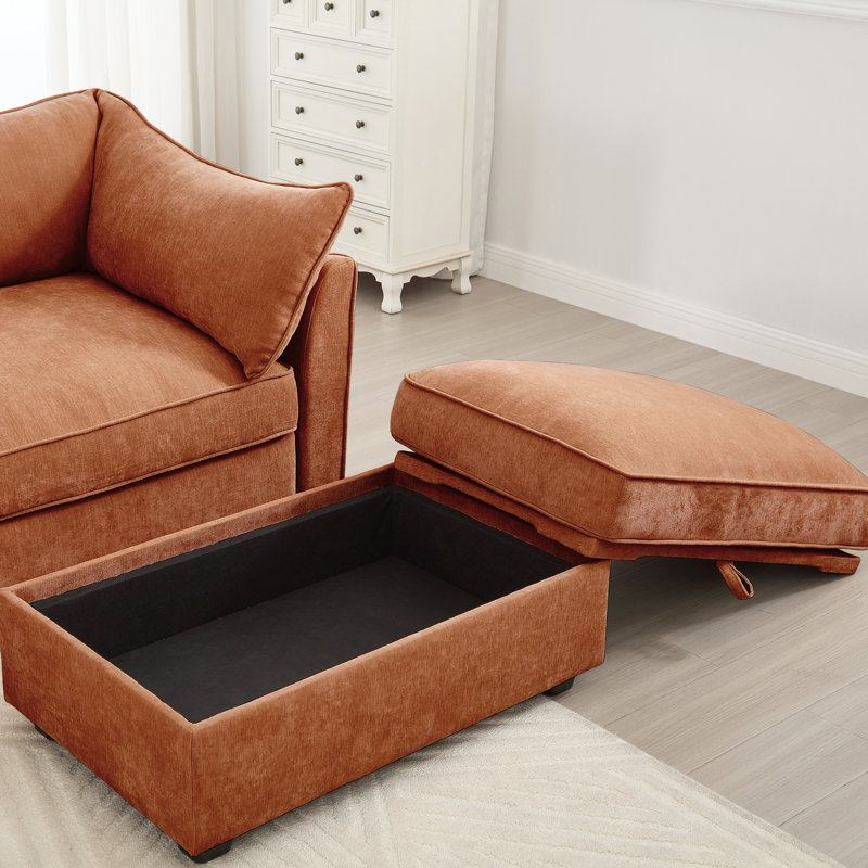 1 siège orange avec passepoil exquis, rangement coulissant et surface en chenille douce, repose-pieds enveloppant