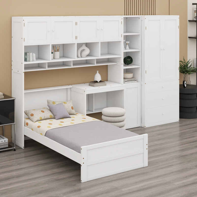 Centre multifonctionnel de sommeil et d'étude avec poste de travail intégré, garde-robe et unités d'organisation complètes comprenant des armoires et des tablettes ouvertes