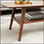 Table basse robuste en bois de chêne massif, finition naturelle, parfaite pour les salons modernes et traditionnels, durable et élégante.