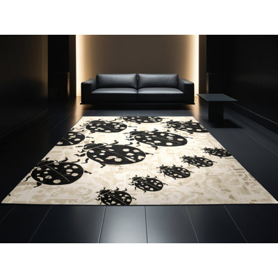 Tapis moelleux moelleux à motif de coccinelles d'inspiration mondiale en beige - reliure noire