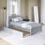 Lit plateforme en bois avec lit gigogne-1138279873
