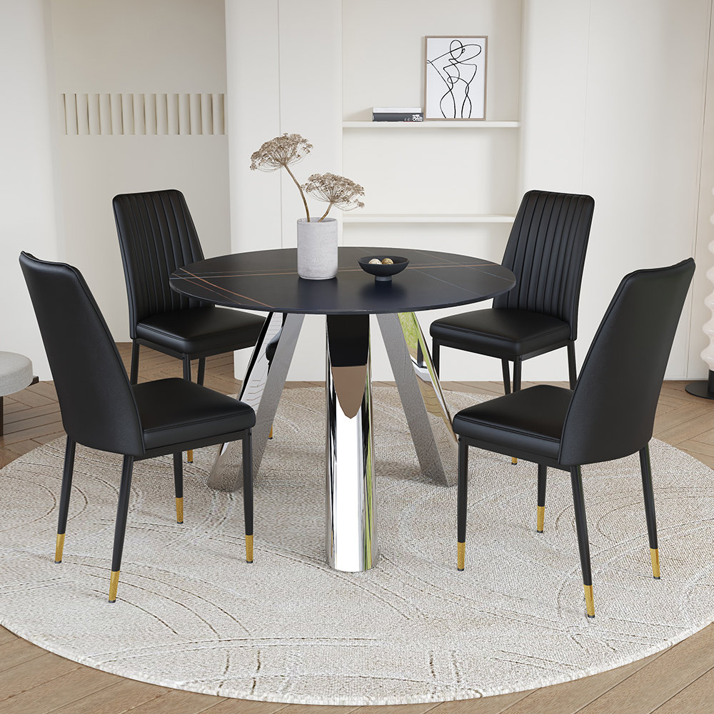 Latitude Run® A 42-inch round dining table with cast iron base and ...