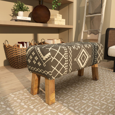 Banc tribal en bois noir avec pieds en bois