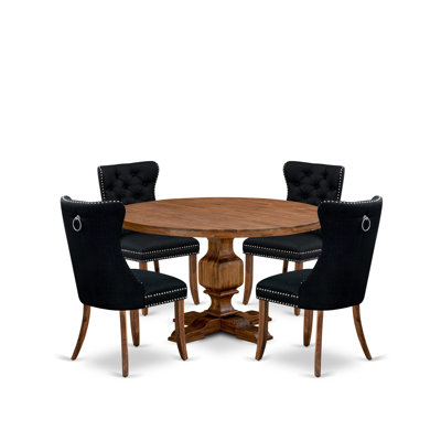 L'ensemble de table de salle à manger 5 pièces comprend une table ronde de 48 po avec piédestal et 4 chaises rembourrées en similicuir bleu marine, noir sablé