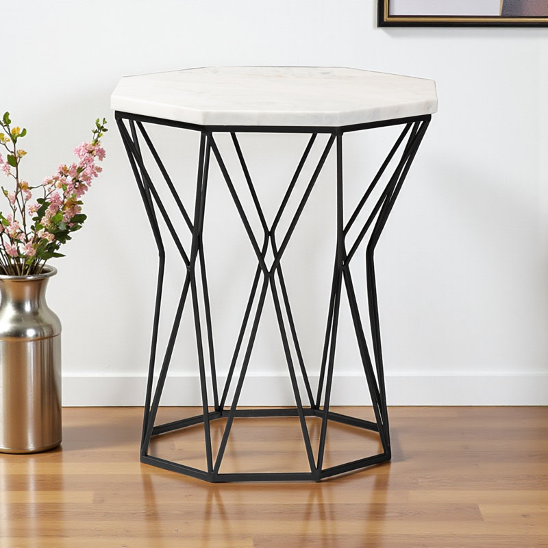 Galen is a modern and contemporary end table made of black metal and marble.