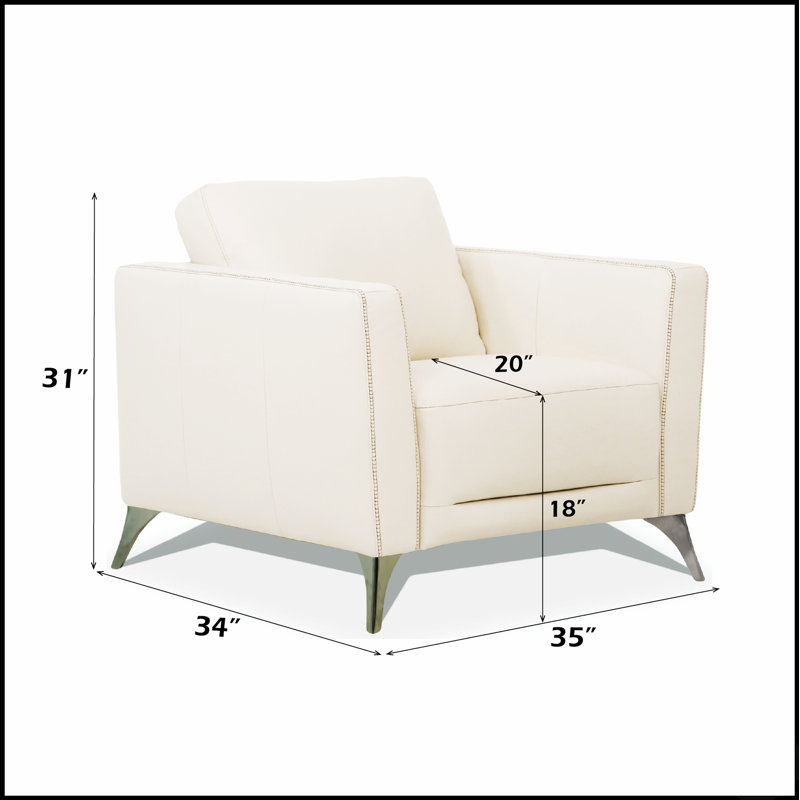 Fauteuil de luxe Malaga en cuir crème, avec dossier confortable et assise ferme, parfait pour une décoration intérieure élégante.