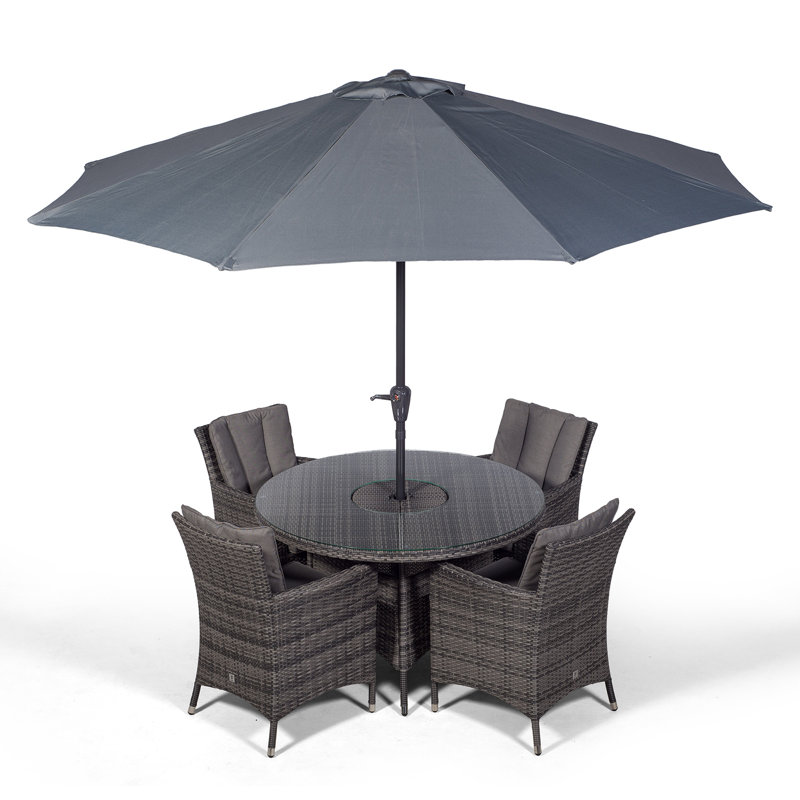 Karcher 4 - Person Wicker Patio Dining Set with Round Table , Cushions Included, Grey