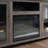 Ellington 70"W Gray Walnut Finish Fireplace TV Stand Console With Heater, LED Light, Cabinets, Shelves