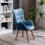Fauteuil d'appoint à dossier capitonné en velours