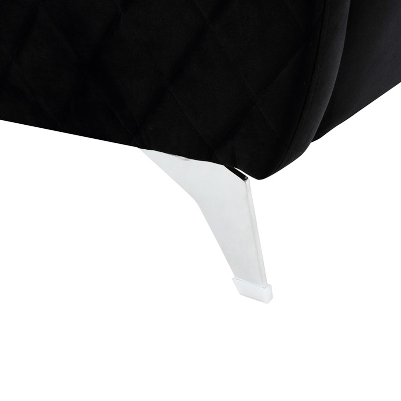 Chaise en velours noir avec pieds stables et rembourrés