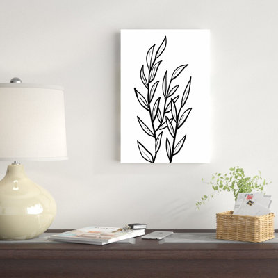 Reproduction de feuilles noires et blanches sur toile