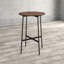 Table de bar ronde en bois massif avec base en métal Léone