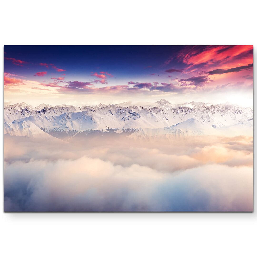 Leinwandbild Schneebedeckte Berggipfel über den Wolken