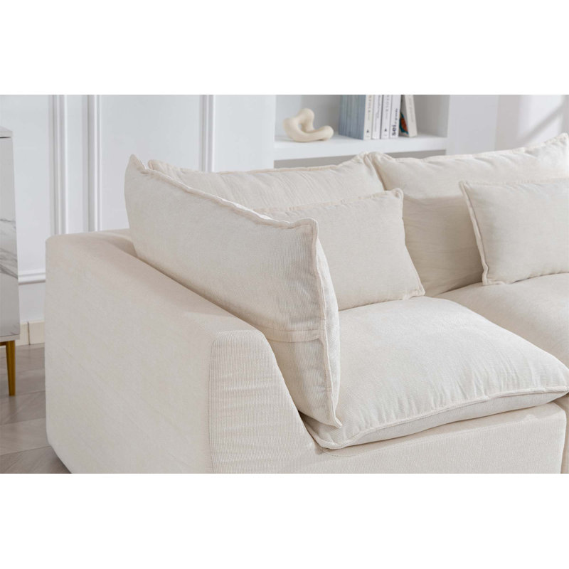 Canapé modulaire surdimensionné surdimensionné avec assise large et profonde, véritable design de relaxation, comprenant un repose-pieds, idéal pour le confort d'un salon spacieux et une configuration flexible.