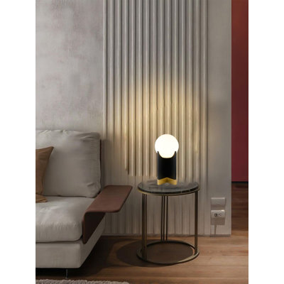 1-Light Table Lamp With A Stain Brass Stainless Steel Base, Black Iron Body, And A White Glass Shade