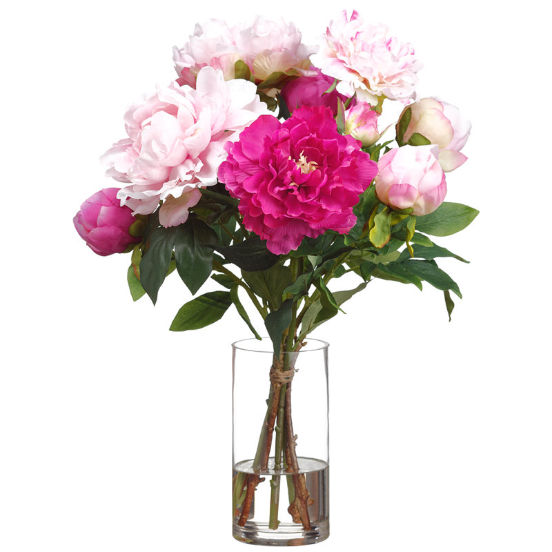 Arrangement de pivoines dans un vase en verre rose deux tons