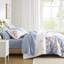 Édredon et drap bleu floral