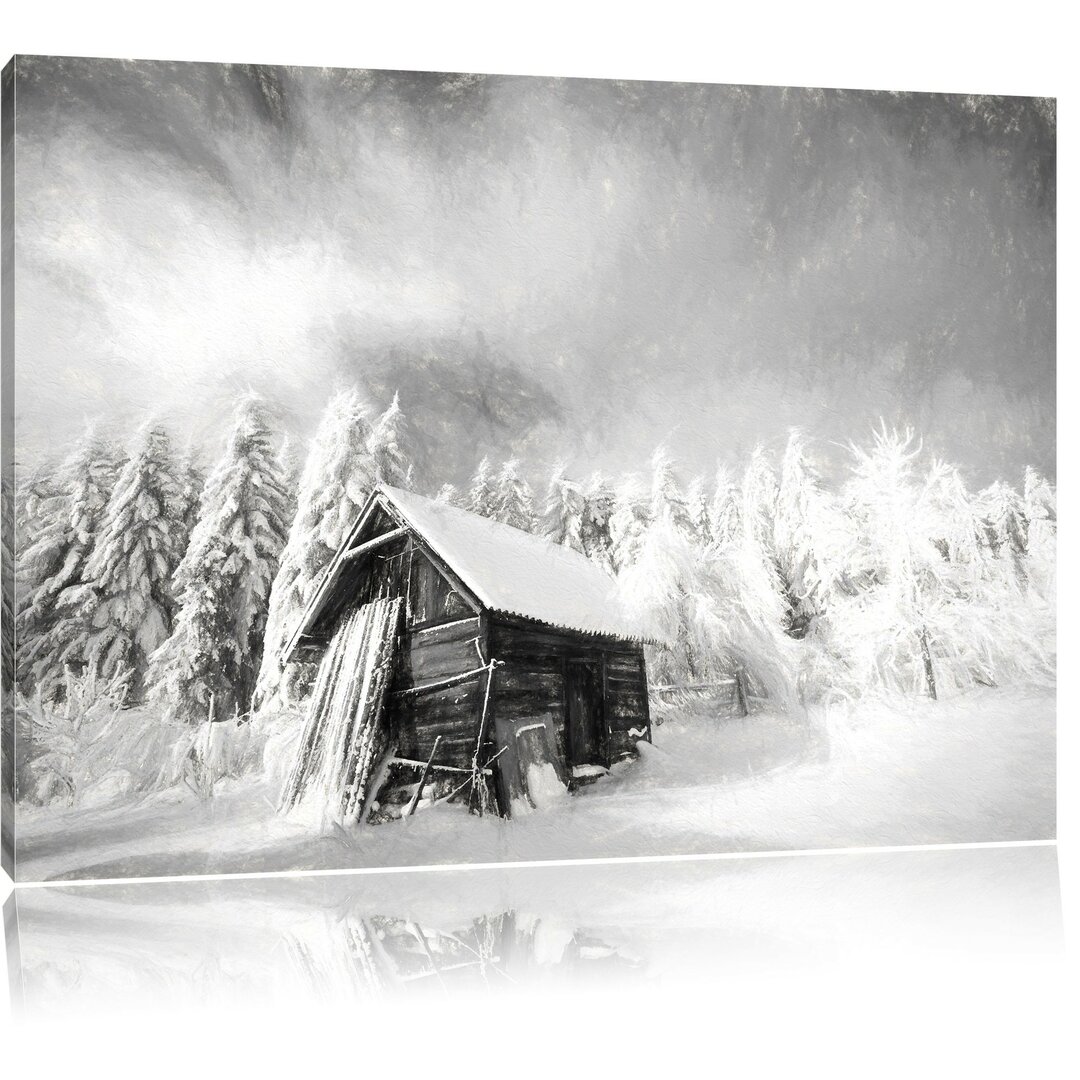 Leinwandbild Holzhütte im Schnee in Schwarz/Weiß