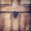 Heurtoir de porte pomme de pin
