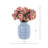 Violets Arranged in Ceramic Vase