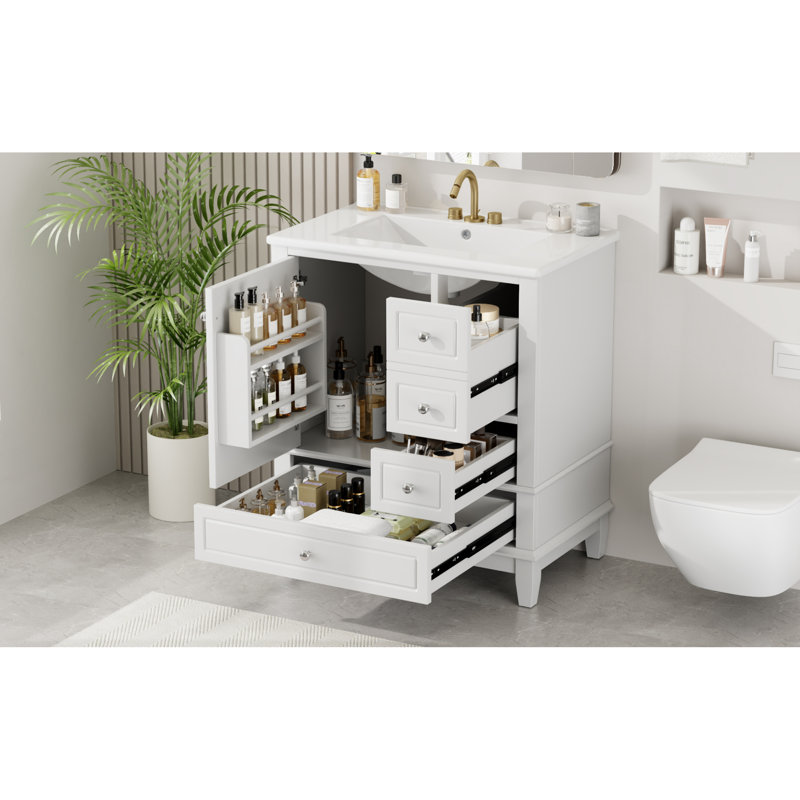 De salle de bain avec lavabo, finition blanche, avec une porte avec tablette, trois tiroirs et une porte à fermeture en douceur