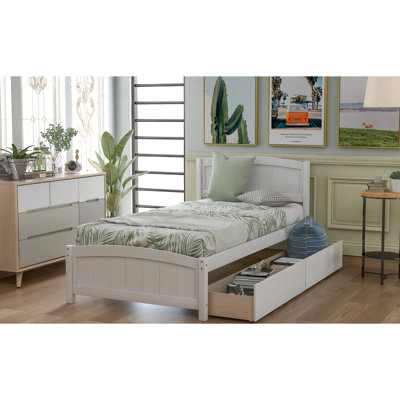 Lit simple blanc avec deux supports de tiroir en bois massif pour une structure de chambre à coucher stable