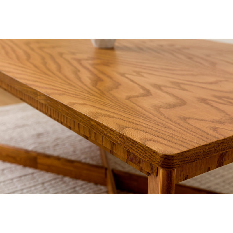 Table basse ronde en verre avec base géométrique dorée
