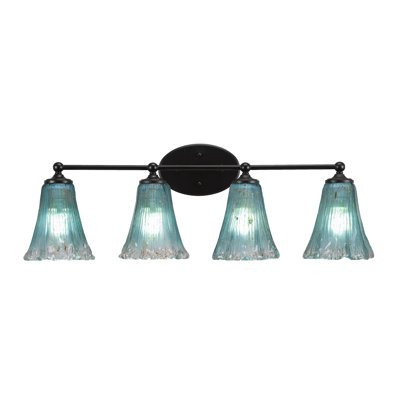 Gerwyn 4 Light Bath Bar Shown In Matte Black Finish With 5.5" Fluted Teal Crystal Glass
