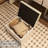 Vanity With Mirrored Lighting And Padded Storage Stool