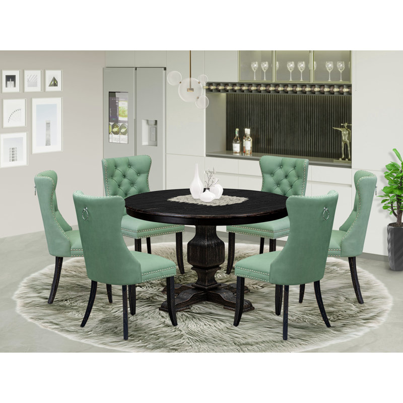 L'ensemble de 7 pièces de coin-repas comprend une table ronde de 48 po avec piédestal et 6 chaises rembourrées en tissu de polyester vert saule, noir sablé
