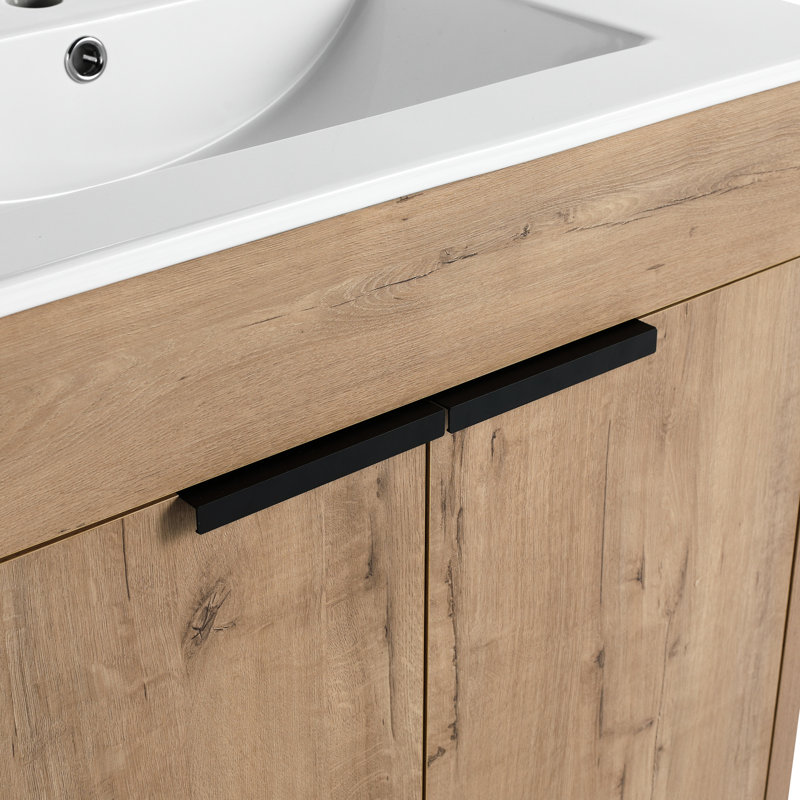 Meuble-lavabo autoportant de 30 po avec lavabo en céramique blanche et 2 portes d'armoire à fermeture en douceur. Style moderne, imitation chêne. Fabrication en contreplaqué. Tablette réglable incluse. Facile à nettoyer et à entretenir