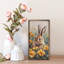 Lapin dans un champ de soucis-699481060