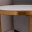 Table d'appoint ronde en pierre frittée avec structure en acier inoxydable doré