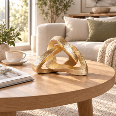 Gold Infinity Knot Resin Sculpture for Coffee Tables Shelves and Bookcases