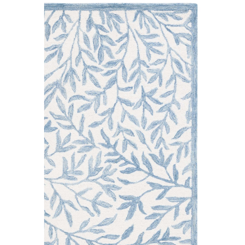 Iqarar Hand Tufted Wool/Cotton Floral Rug in Blue/Ivory, Rectangle 2' x 3'