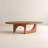 Modern Walnut Oval Coffee Table with Sculptural Arch Base