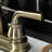 Kingston Brass Restoration Two-Handle 3-Hole Deck Mount 4" Centerset Bathroom Faucet with Plastic Pop-Up-66069158