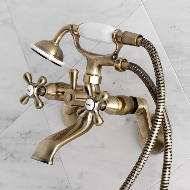 Robinet de baignoire sur pattes à deux poignées et à deux trous avec pomme de douche à main Kingston Brass, Vintage Brass