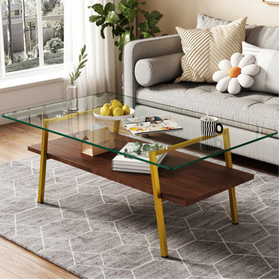 Table basse polyvalente avec surface en verre transparent et pieds en métal robustes