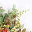 Arrangement floral fausses baies et eucalyptus en pot