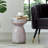 Iridescent Glass Accent Table with Artistic Design and Sturdy Base.