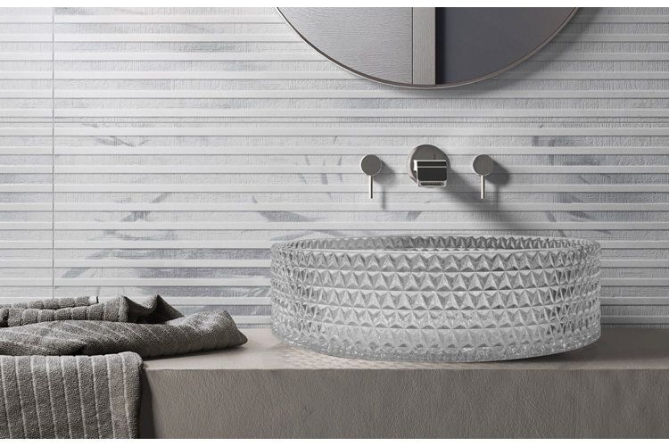 glass vessel sink atop a slate counter