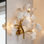 Applique murale 4 lumières Ginkgo Biloba dorée moderne
