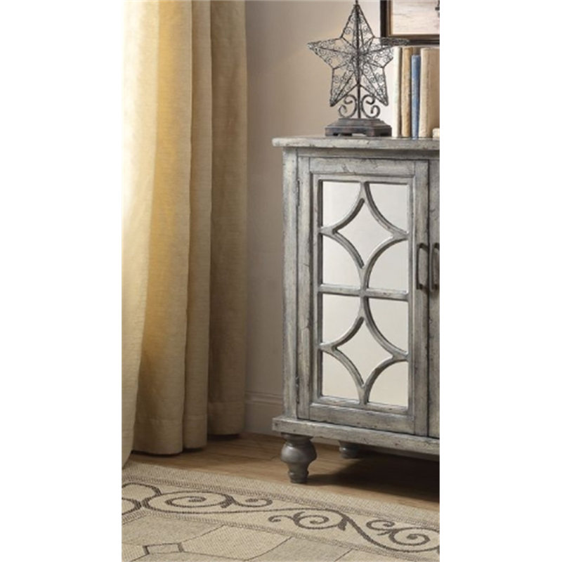 Console Velika au fini gris patiné avec portes et rangement en miroir, parfaite pour un décor intérieur élégant et fonctionnel.