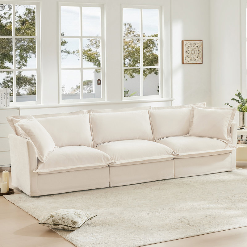 Canapé confortable en chenille pour le salon, offrant une détente inégalée, plusieurs coussins et un design moderne et élégant